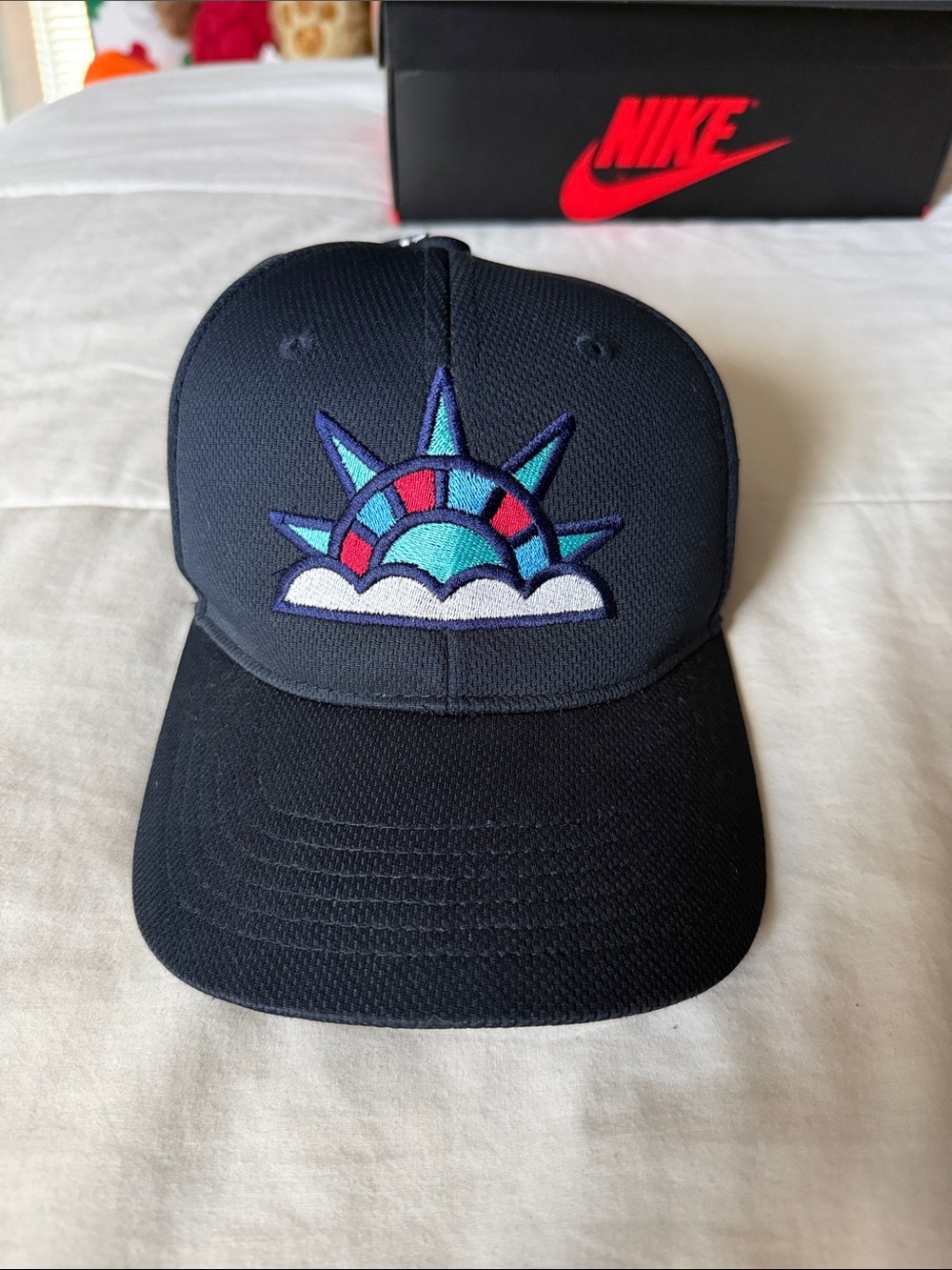 Nike Kids Black Hat with Teal, Purple, Red & White Statue Patch